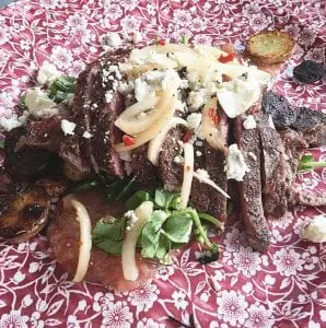 Ribeye steak with watercress, celery rhubarb sauce, blue cheese, and fingerling potatoes. (Photo provided)