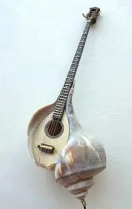 She shall Mandolin (seashell, wood, metal string, mother pearl, old piano key, brass), by Kazumi Tanaka 