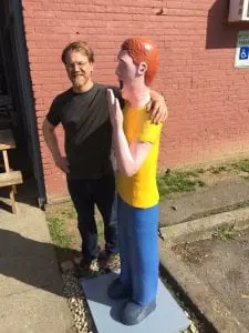 Sculptor Jon Reichert with the Yawner after installation. (Photo by Eleni Smolen) 