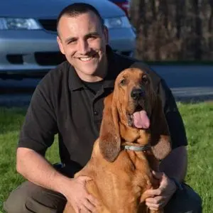 Chase with his handler, Criminal Investigator Randel Hill (photo provided) 