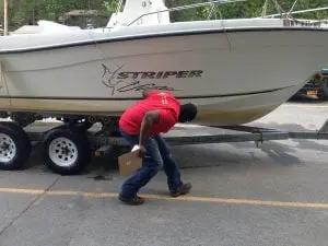 A Clearwater steward looking for invasive species trespassers on a boat before it goes in the Hudson River. (photo provided)