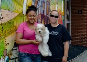 Kaylasha Fryar, dog Puggie, and mom Natacha Laboy outside Beacon's Howland Library after ordering a bunch of new items. Mom likes military and horror themes and daughter likes Manga (Photo by A. Peltonen)