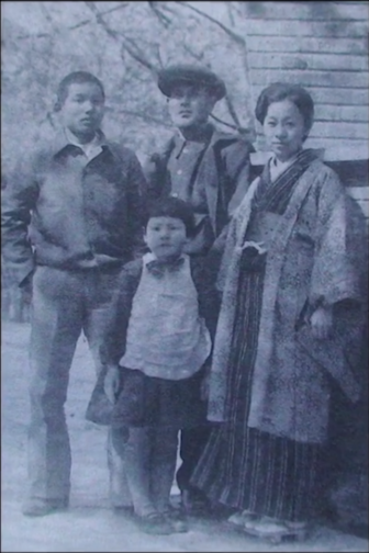 Tomiko Morimoto (center)  with family members in the early 1940s