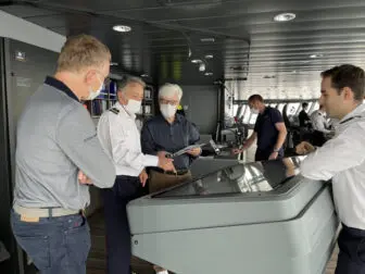 At left, French science writer and photographer Serge Brunier, Capt. Etienne Garcia and Joe Rao on the ship’s bridge