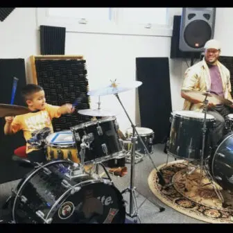 J. Why, teaching drums