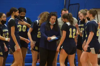 Coach Christina Dahl outlines strategy for her team, which has won four straight games.