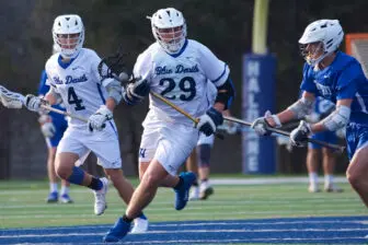 Dylan Rucker (29) moves across midfield against Dobbs Ferry.