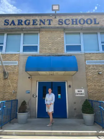 Catie Biordi stands outside Sargent Elementary in Beacon, where she will take over as principal on Aug. 1.