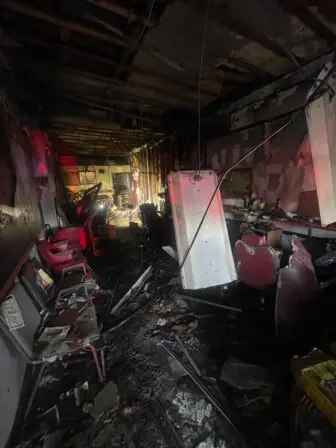 A photo provided by the Beacon Fire Department shows the wreckage inside Bell’s barbershop.