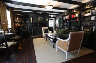 The lounge features leopard-print upholstery on the side chairs.