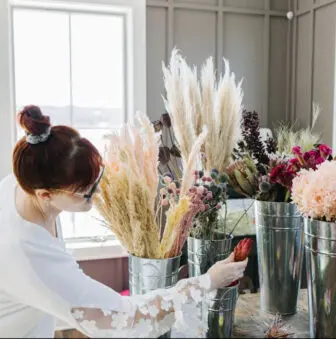 Hilbrenner makes and delivers flower arrangements.