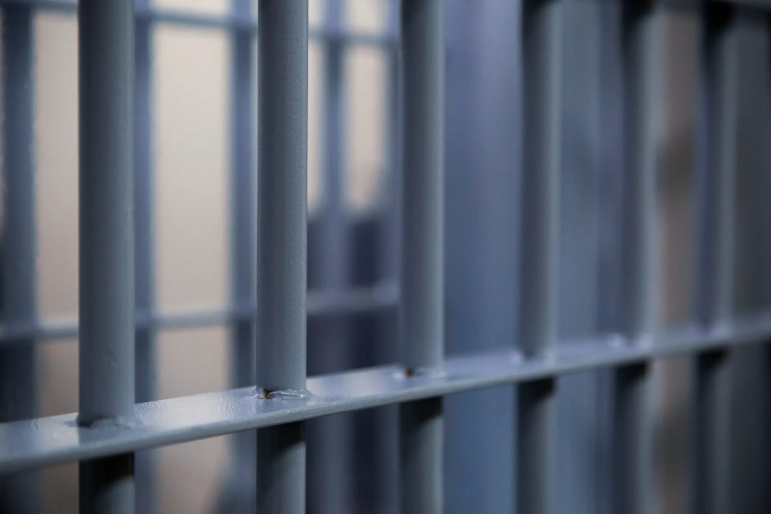 Typical modern prison bars. Symbolic illustrative