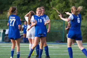 Finola Kiter (6), who scored the team's first two goals, celebrate's with Anna-Cat Nelson (19) after her go-ahead score in the second half Wednesday at Haldane.