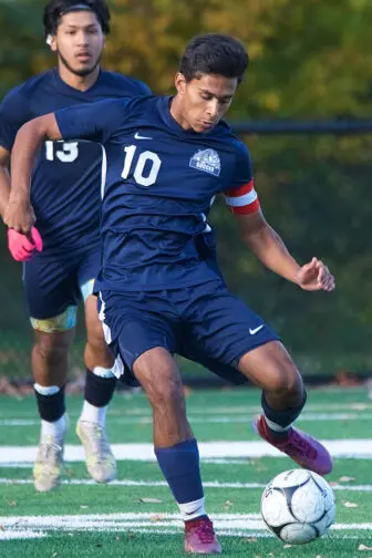 Andre Alzate pushes the ball upfield in Tuesday's win over Cornwall. Photo by S. Pearlman