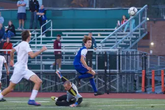 Max Westphal of Haldane chips a shot over the keeper for one of his two goals on Nov.5 in a win that sent the Blue Devils to the final four. Photo by S. Pearlman