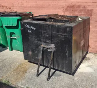 The lockbar (foreground) was removed to gain access to the grease vat behind One More Bite. Photo provided