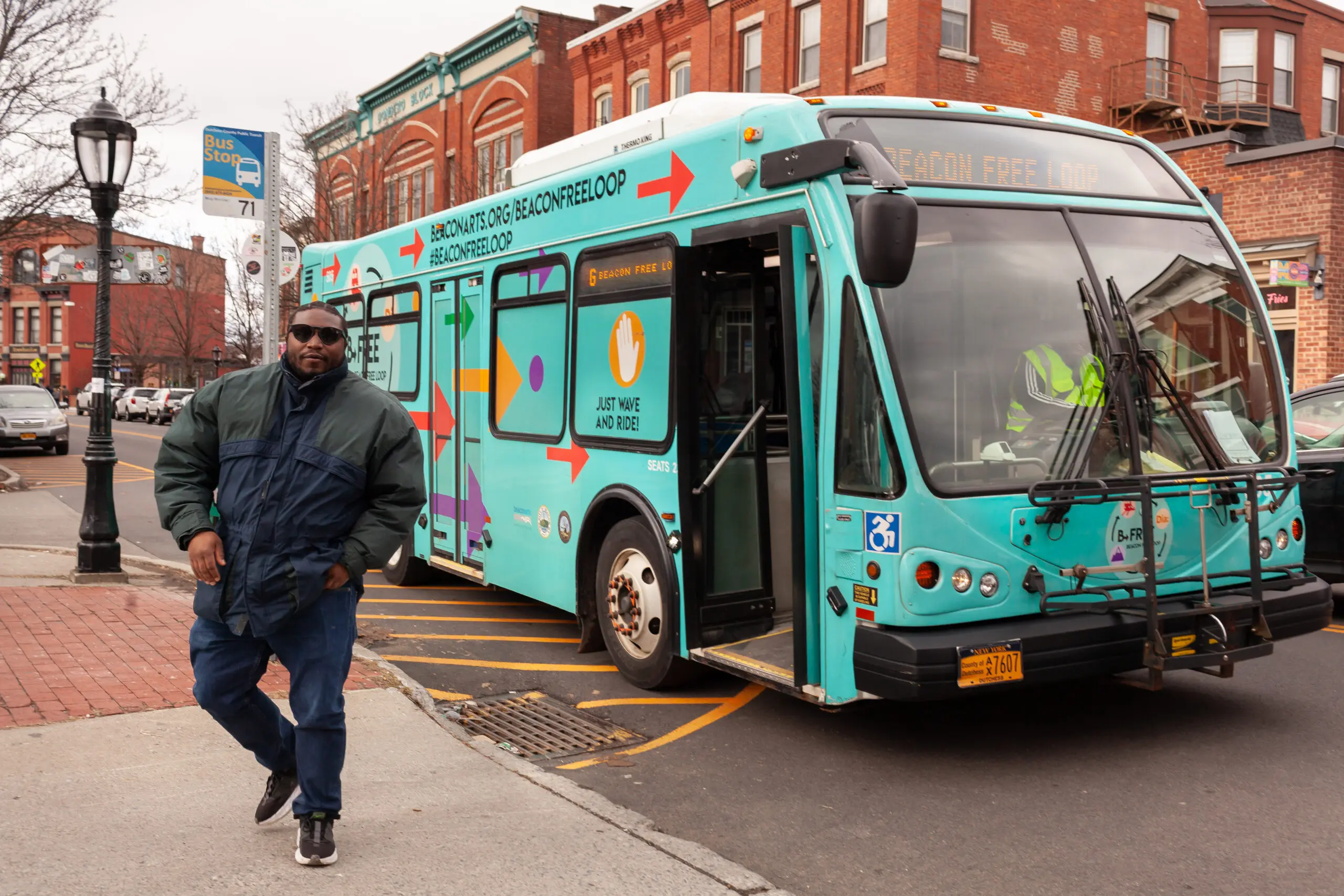 A rider departs the Beacon Free Loop bus on Main Street. Photo by Valerie Shively