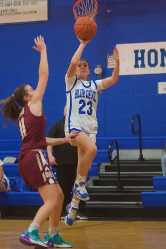 Mary Peters (23) glides past an O'Neill defender.