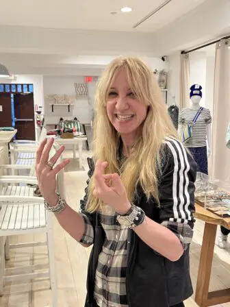 acqueline Azria, Paulette’s proprietor, communicates with hand gestures