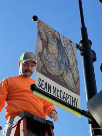 Highway crew members installed the banners.