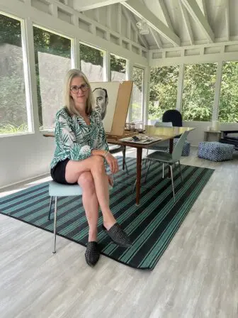 Michelle Vaughan drawing on the porch at her Garrison home