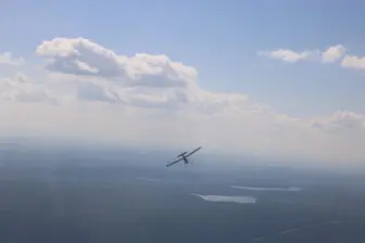 The tow plane departs.