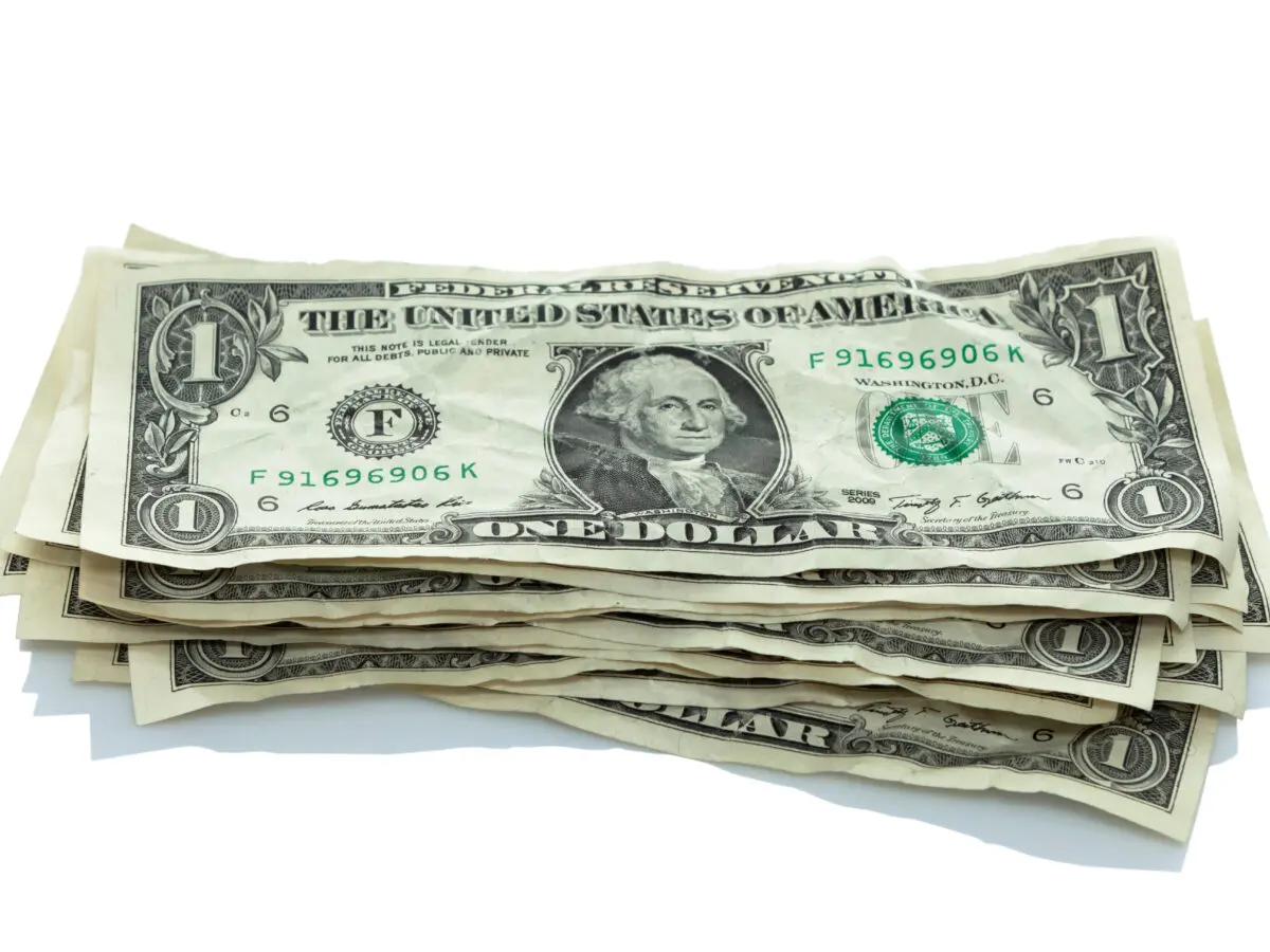 small stack of dollar bills, money
