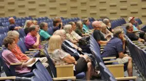 A photo of the audience at Lawler's Aug. 22 town hall provided by his staff shows reporter Liz Schevtchuk Armstrong taking notes, at far left. Photo provided