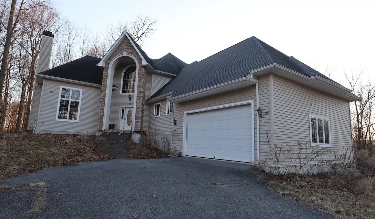 The former owners of 21 Huyler Drive in Hyde Park are among the plaintiffs suing Dutchess County over the proceeds from its foreclosure auctions. (Absolute Auctions & Realty)