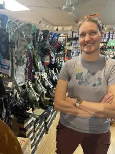 Katy Behney of Mountain Tops Outfitters with her stock of unsold snowshoes