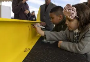 Participants at a March 7 event signed a beam that will be used in the new Food Bank of the Hudson Valley facility.Photo provided