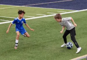 Miles Lucca (right) faces off against a Beacon Wolves defender in a game on April 20.