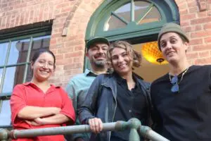 Project Director Theresa Dobrash, owners Kamel and Lena Jamal and Creative Director Mallory Lemieux pose outside at The Station in Beacon this past fall, when the building was the site of marijuana “showcases.” File photo by Michael Turton