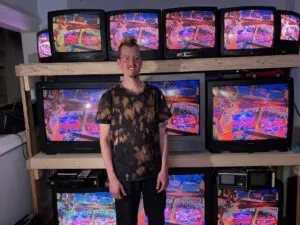 Beacon artist Chris Loers, aka “Rooster,” with one of his installations Photos provided