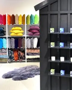 Burkelman sells pillows and rugs as well as parfum-infused soy wax candles.