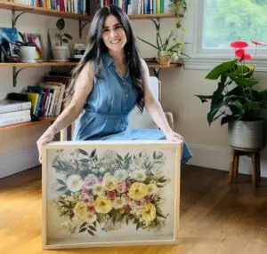 Jackie Murphy-Kahn with one of her framed flower arrangements (Photo by Ethan Kahn)