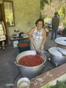 Maria DiLello makes tomato sauce on Labor Day at the Maple Lawn Farm Market.Photos by J. Asher