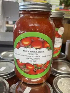 The sisters and their family made hundreds of jars of Nonna Anna's Sauce to sell at their market.