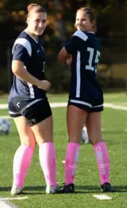 Drew Kelly (right) credits her older sister, Devyn, with helping her academically and athletically. Photo provided
