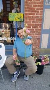 David Shelly offers a rose.