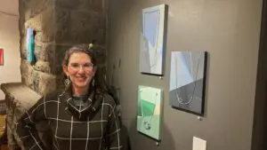 Yali Lewis with her artwork at Found Space Gallery in Cold SpringPhoto by M. Ferris