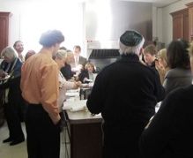 Congregation members gather in the St. Mary's kitchen after the service to break bread