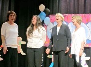 School staff in song, Jodie Rowland, Kristen Savastano, Maggie Davis and Susan Kelly