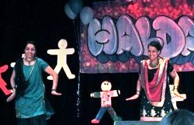 Simrin Gosal (l) and Kiran Singh performing a Bhangra dance