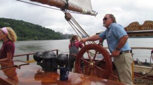 Mystic Whaler's Owner and Captain John Edgington at the helm