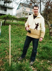 James Geppner with a winter garden romaine lettuce plant, at home in Cold Spring