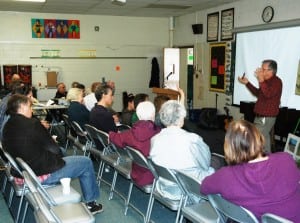 Ray Curran makes a point in a group discussion