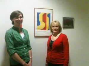 Cheryl McKeever and Diane Russo with one of many client created works of art adorning the walls of PFCS