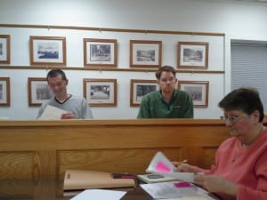 Mayor Tom Corless, Trustee William Duncan and Village Clerk Pauline Minners at the Monday, Dec. 17 meeting. Photo by J. Tao