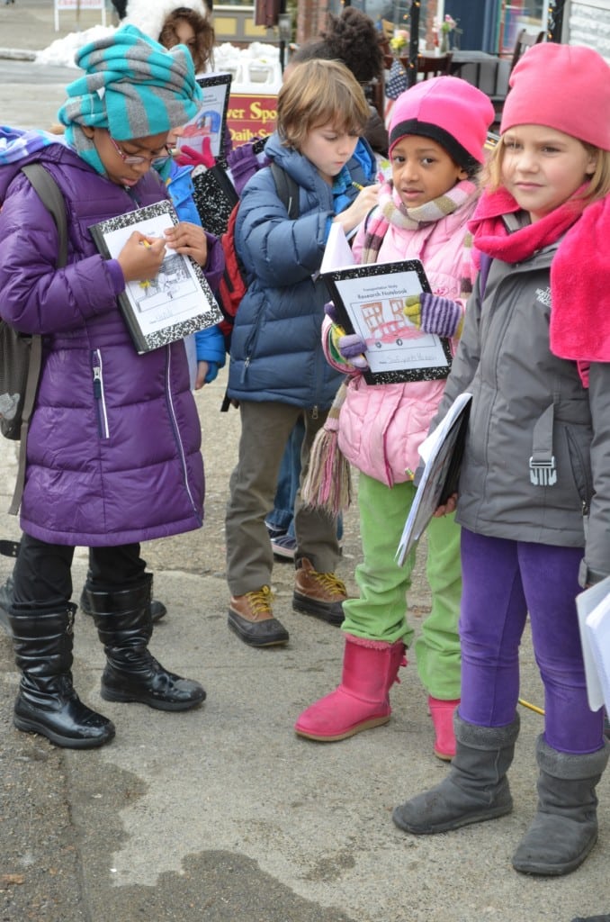 Community Roots second-graders prepare for an interview in Caroyln's Flower Shoppe in Cold Spring on Jan. 17. Photo by Jeanne Tao